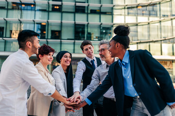 Wall Mural - Business team in huddle in street