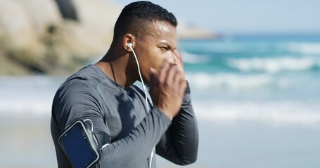 Aufkleber - Exercise, workout and fitness man listening to music through earphones and running on a beach for cardio health. Black fit athlete training, sports and using a cellphone app to track progress