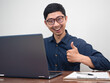 © Thanasak - Young businessman cheerful show thumb up about success with working