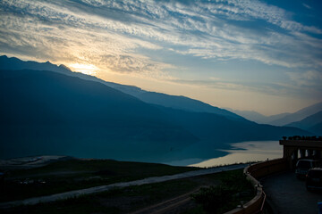 Wall Mural - Sunrise view of Tehri mountains. Scenery sunrise over Tehri Lake, Uttarakhand. Tehri Dam, the tallest dam in India and Tehri dam is Asia's largest man-made lake.