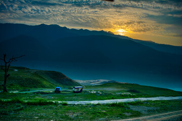 Wall Mural - Sunrise view of Tehri mountains. Scenery sunrise over Tehri Lake, Uttarakhand. Tehri Dam, the tallest dam in India and Tehri dam is Asia's largest man-made lake.