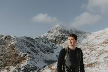 Male Hiker In Snowy Mountains, Snowdonia, Wales
