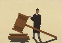 Male Judge Standing At Large Gavel
