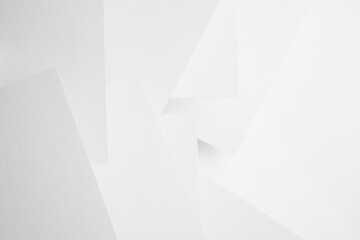 Poster - white abstract geometric background with soft light paper surfaces fly as random volumetric pattern 