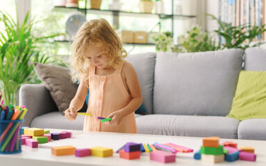 Wall Mural - Cute girl coloring with markers