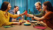 © StockPhotoPro - Happy friends toasting and eating together at home