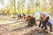 © Robert Kneschke - Children planting trees as a voluntary climate protection campaign