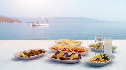 sea ​​food on the table, in front of the sea background, close up