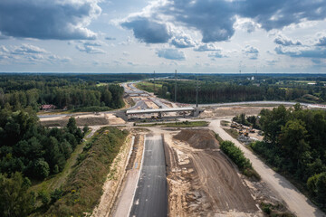 Canvas Print - Drone photo of building site of express road S7, view in Ruda village near Tarczyn city, Poland