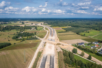 Wall Mural - Drone photo of building site of express road S7, view in Ruda village near Tarczyn in Poland