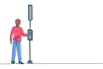 Poster - Single continuous line drawing a man pushes a button at a traffic light to cross the road on a zebra crossing. Road is busy during office hours Dynamic one line draw graphic design vector illustration