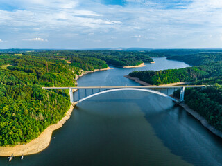 Wall Mural - The Zdakov Bridge Steel Arch Bridge that spans the Vltava River,Czech Republic. Aerial View. Czechia, Europe.