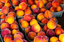 Closeup Shot Of Delicious Fresh Peaches At A Market
