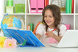 © aletia2011 - Cute little girl ding home work at desk