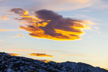 Wall Mural - Mountain with a Lenticular cloud at sunset