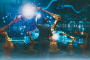 Wall Mural - industry engineer in factory,using smart interface screen control automated robot arm machine learni