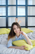 © racool_studio - This enchanting brown-haired model exudes comfort and relaxation as she lounges on her bed, striking a variety of poses that are perfect for lifestyle blogs