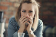 © racool_studio - Picture of young blond woman with short hair looking at camera and drinking a cup of tea in the kitchen