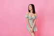 Photo of pretty adorable girl dressed off shoulders outfit looking empty space isolated pink color background
