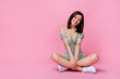 Full length photo of sexy lady sit near empty space wear dress sneakers isolated on pink color background