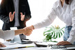 © crizzystudio - Close-up Businessman's handshake at the negotiating table after making an agreement. Businessman meeting at the office.