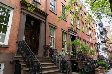 Wall Mural - Row of Old Colorful Brick Residential Buildings along a Sidewalk in Chelsea of New York City