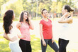 © racool_studio - A group of sporting beautiful young girls communicate with each other in nature