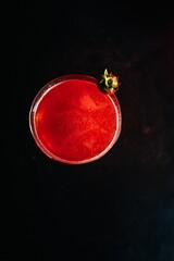 Poster - Strawberry daiquiri cocktail in a glass from above with a strawberry decoration