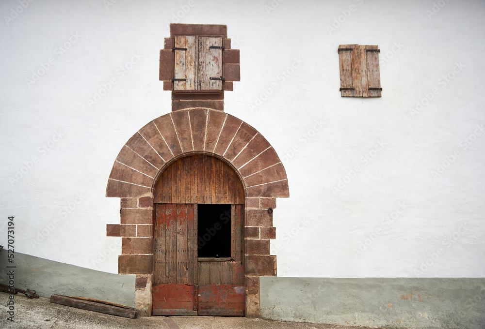 typical house in the north of spain with a semicircular stone arch at ...