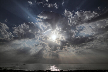 Wall Mural - Cloudy sky with sun rays