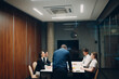 © primipil - Businessman and businesswoman team at office meeting. Business people men and women group conference discussion with boss