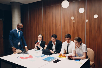 Businessman and businesswoman team at office meeting. Business people group conference discussion sit at table with boss man and woman