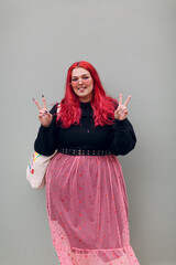 Wall Mural - Plus size overweight fat body positive lgbtq woman with red hair and pink glasses.