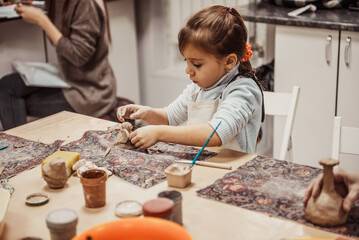 children's hands sculpts clay crafts pottery school