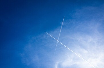 Low angle view of two airplanes flying and leaving a trail of smoke behind