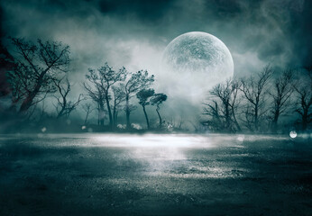fog in spooky forest at night with full moon on asphalt - abstract bokeh lights and tone filter