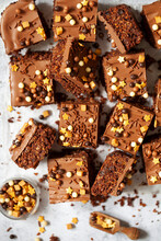 Aussie Crunch Chocolate Bars Cut Into Squares And Topped With Milk Chocolate And Sprinkles.