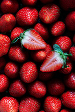 Strawberries, Halved Macro On A Bed Of Strawberries