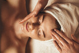 Close-up of young woman getting spa massage treatment at beauty spa salon. Cosmetology beauty skin care anti-aging treatment rejuvenation. Body care, spa