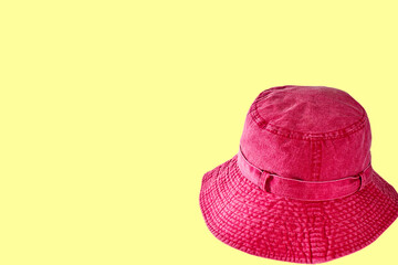 A pink red hat with sunglasses isolated on colored background