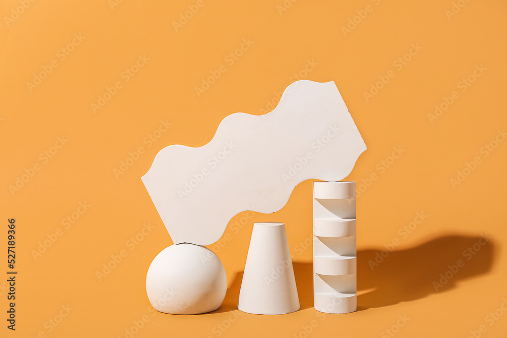Abstract composition with different showcase pedestals on color background