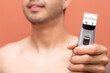 © Narayan - man with hair clipper, haircut concept