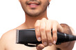 © Narayan - man with hair clipper on white background, haircut concept