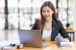 © David - Cropped photo of Freelancer business Asian woman holding coffee cup and at doing planning analyzing the financial report, business plan investment, finance analysis the workplace.