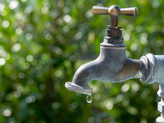 Garden tap with water drip