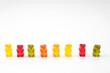 © epovdima - Row of jelly bears isolated on white background