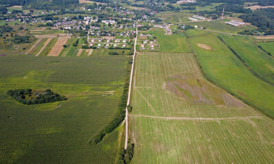 Wall Mural - Aerial view of agro rural fields. Harvesting on the farm landscape