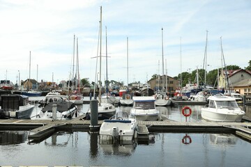 Canvas Print - Beautiful view of city pier with modern boats