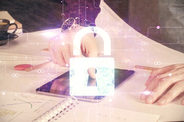 Aufkleber - Multi exposure of man's hands holding and using a digital device and lock drawing. Security concept.