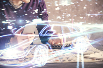 Poster - Double exposure of man's hands holding and using a digital device and automobile theme hologram drawing. Technology concept.